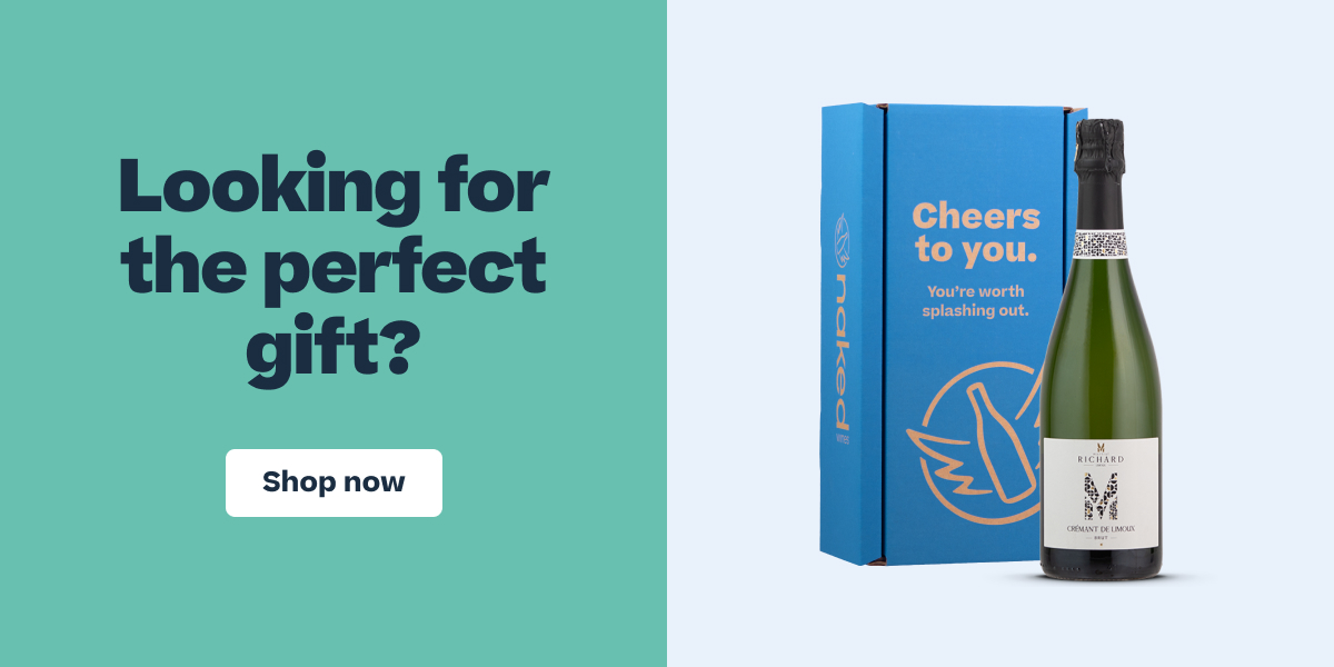 Naked Wines gift advertisement featuring a Crémant de Limoux sparkling wine bottle beside a blue gift box reading "Cheers to you," with a "Shop now" button.