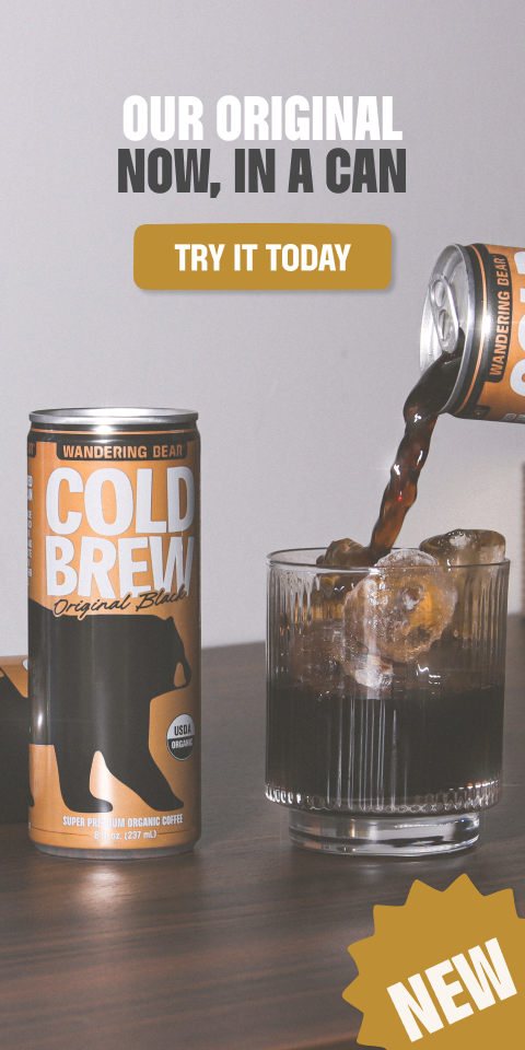 Wandering Bear Cold Brew Original Black coffee can being poured over ice into a glass, with "Try It Today" button