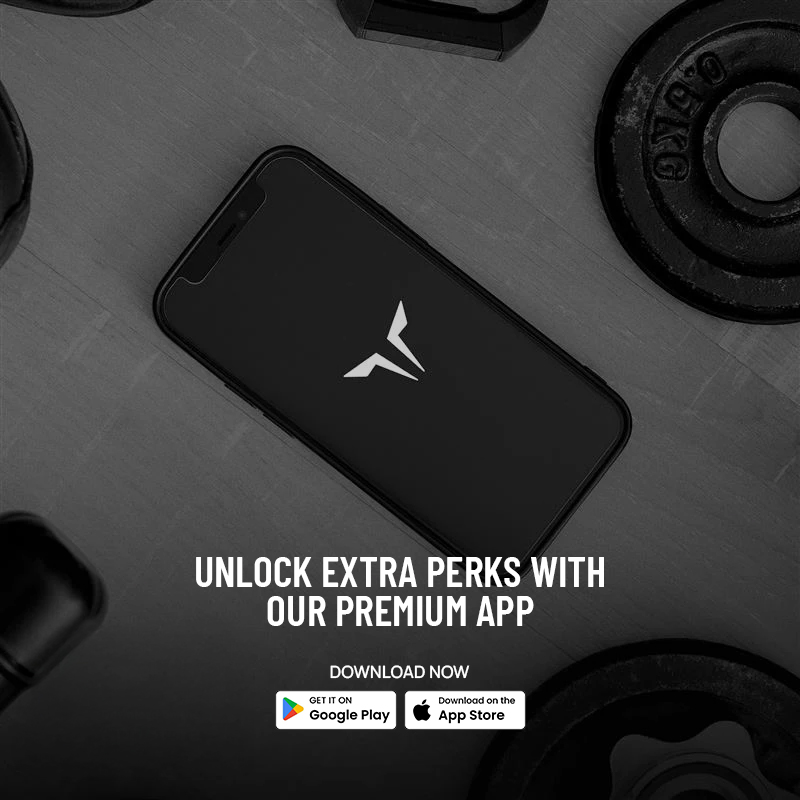 Black smartphone with fitness app logo on screen surrounded by gym weights and equipment. Text reads "Unlock extra perks with our premium app" with download links for Google Play and App Store.