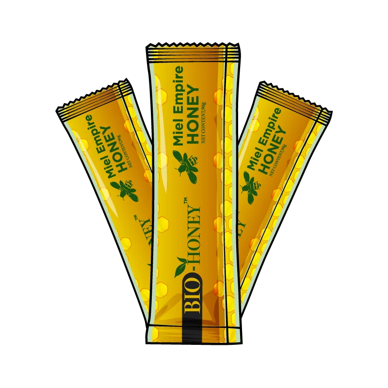 ```html
<img src="image.png" alt="Three yellow and black honey stick packs labeled 'Miel Empire Honey' with a bee graphic, arranged in a fan shape." />
```