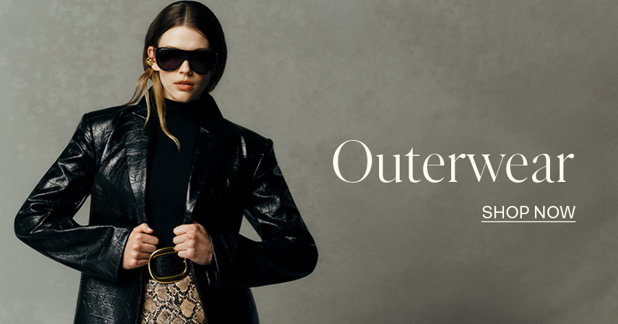 Woman wearing black leather blazer, turtleneck, sunglasses, and snakeskin bag; "Outerwear Shop Now" text overlay.