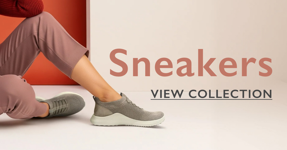 ```html
<img src="image.jpg" alt="Person wearing gray sneakers with pink pants, text 'Sneakers View Collection' on a light background." />
```