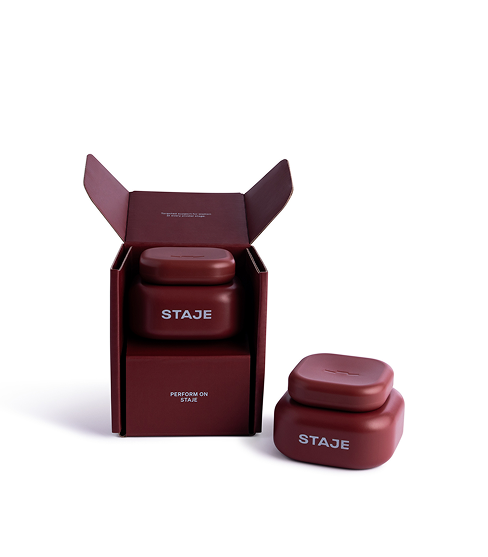 ```html
<img src="image.png" alt="Two red containers labeled 'STAJE', one inside an open box and another placed beside it." />
```