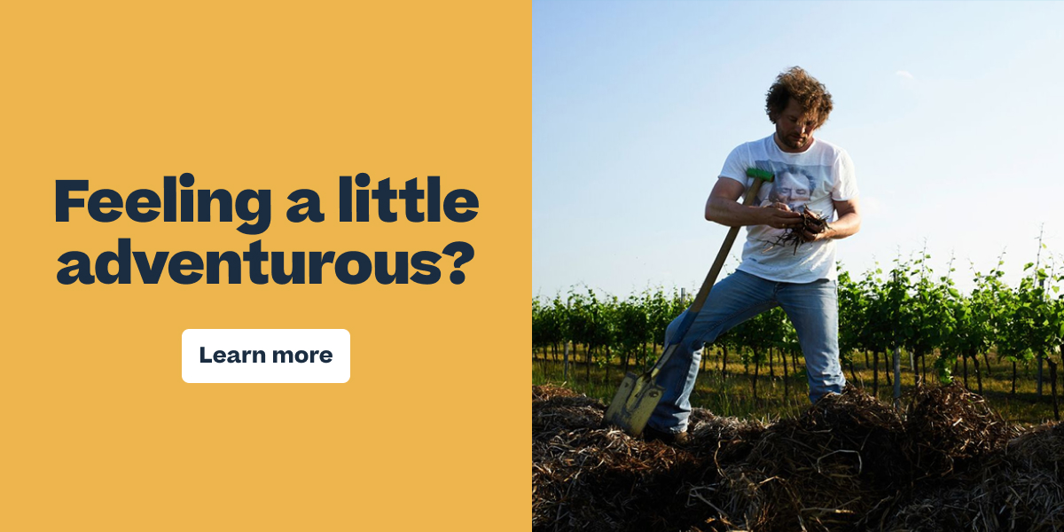 Man digging with a shovel in a vineyard next to text reading "Feeling a little adventurous? Learn more"