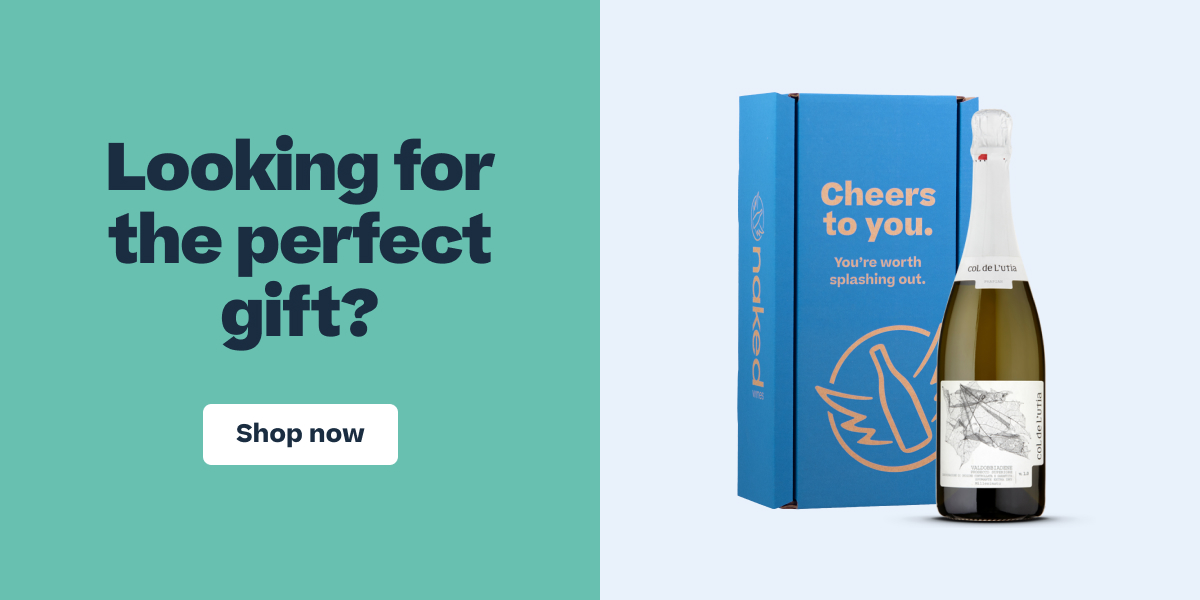 Blue gift box with champagne bottle displaying text "Cheers to you. You're worth splashing out" alongside Shop now button.