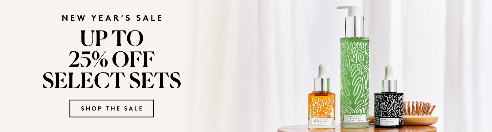 ```html
<img src="image.png" alt="New Year's Sale advertisement with up to 25% off select sets. Features skincare products including a pump bottle, dropper bottles, and a small brush on a wooden surface.">
```