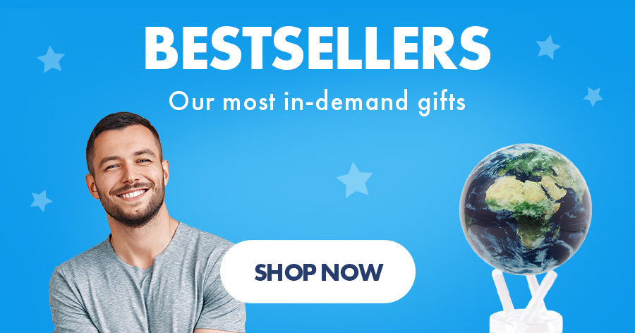 Bestsellers promotional banner featuring a smiling man and a globe figurine with "Shop Now" button on blue background.