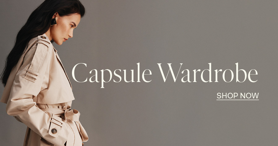 ```html
<img src="image.jpg" alt="Woman in a beige trench coat, text reads 'Capsule Wardrobe, Shop Now' on a gray background">
```