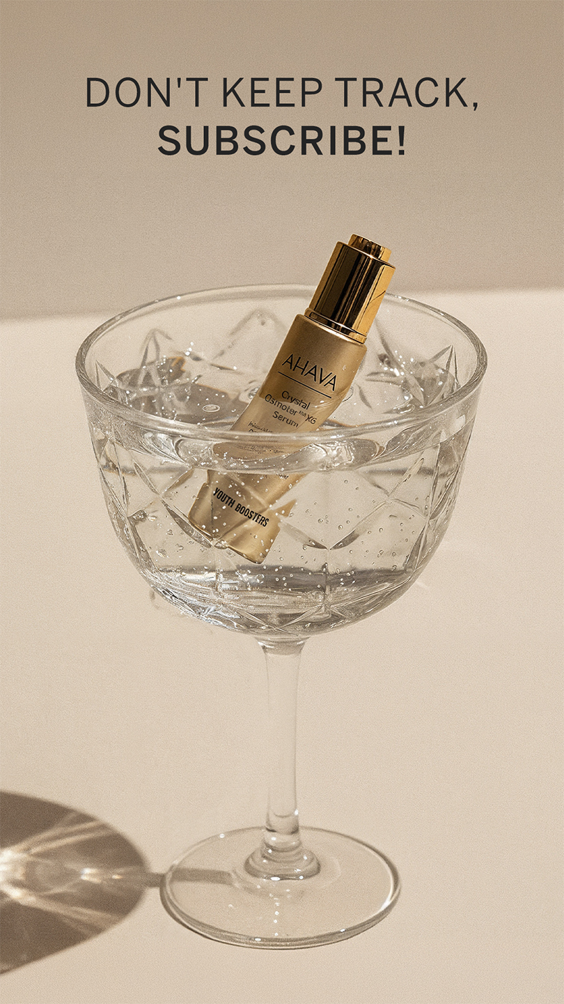 A bottle of AHAVA Crystal Osmoter X6 Serum is placed in a crystal glass with ice, against a beige background. The text above reads "DON'T KEEP TRACK, SUBSCRIBE!"