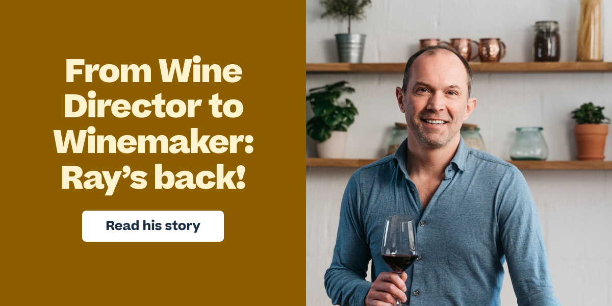 Smiling man holding a red wine glass, with text "From Wine Director to Winemaker: Ray's back!" and a "Read his story" button.