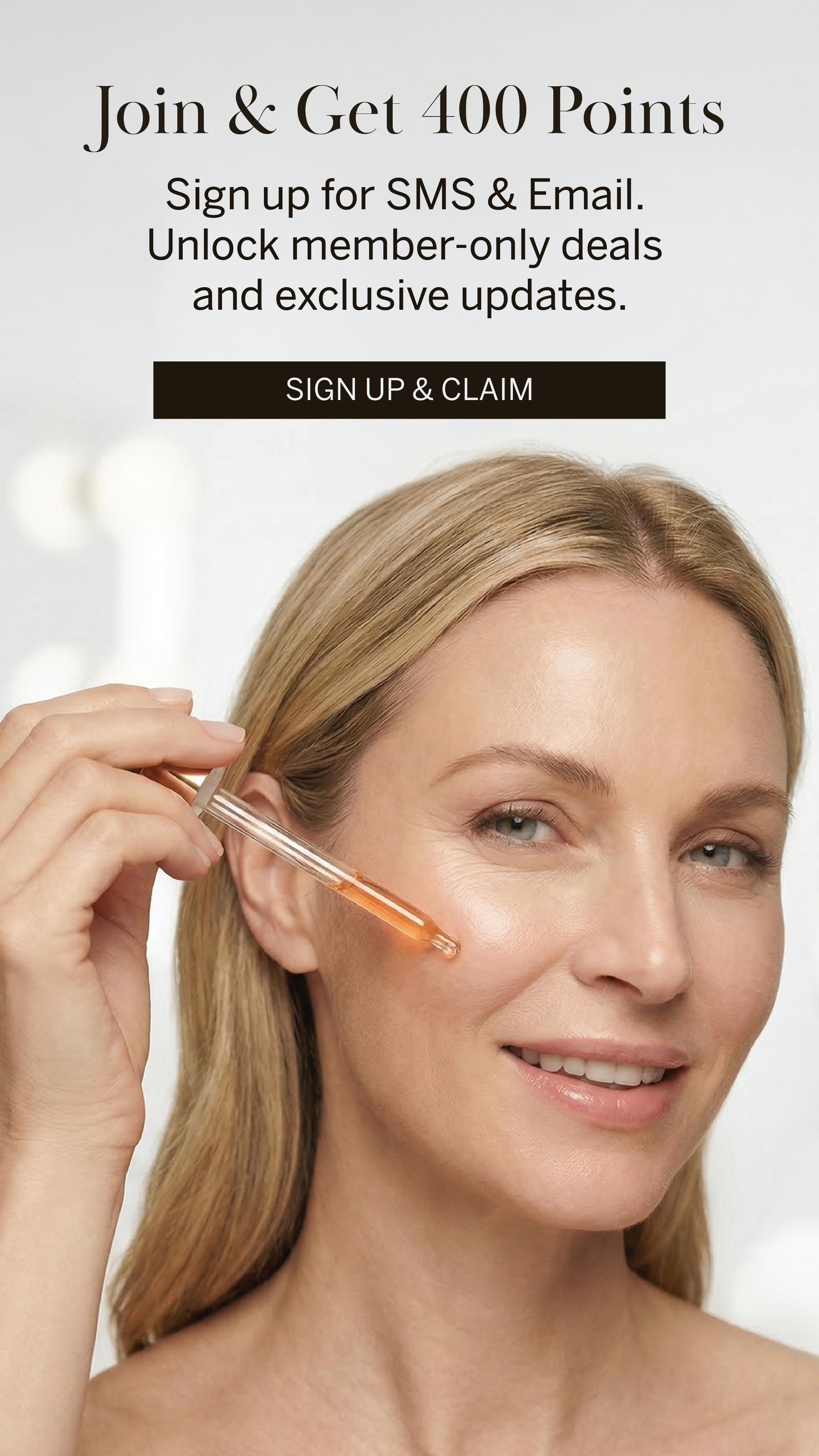 ```html
<img src="image.jpg" alt="Advertisement offering 400 points for signing up for SMS and Email, featuring a person applying a product to their hair with a dropper." />
```