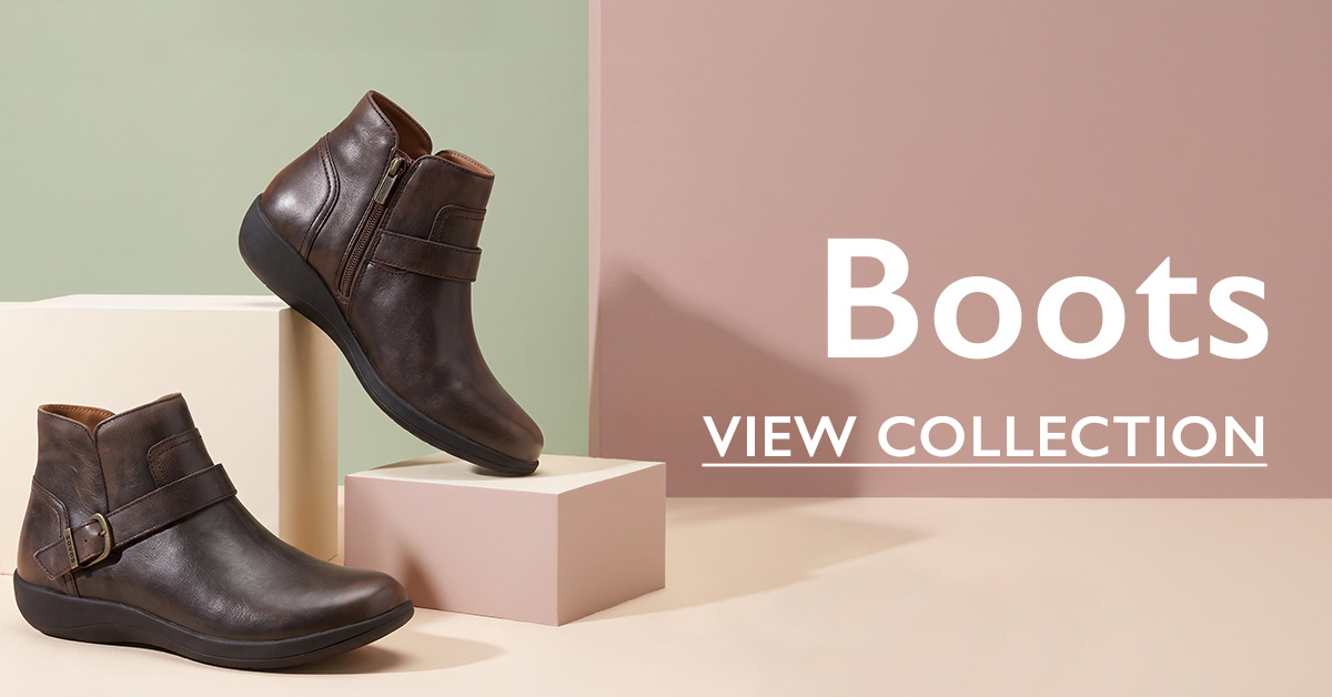Two brown leather ankle boots with buckle and zipper details displayed on pastel blocks, with "Boots - View Collection" text