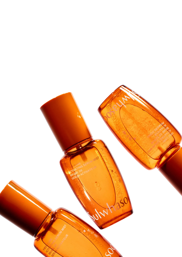Three orange Sulwhasoo Activating Serum Mist bottles arranged diagonally on a white background