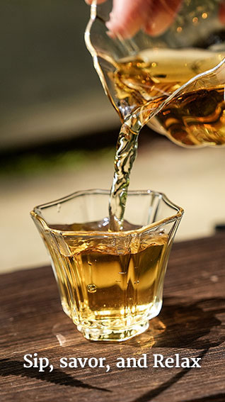 ```html
<img src="image.jpg" alt="Pouring tea into a glass cup with text 'Sip, savor, and Relax' at the bottom." />
```